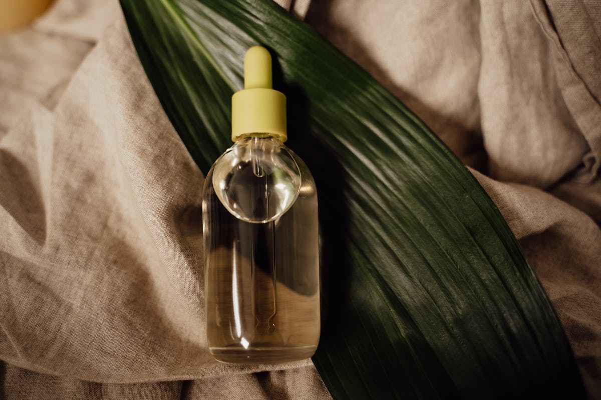 English Bay body oil in a glass dropper bottle on linen